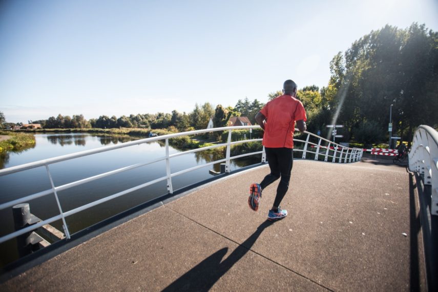 Runner (jogger) on a bridge over the river Rotte