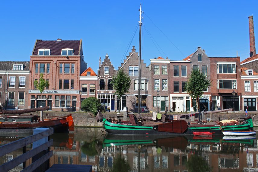 View of old Dutch gables on the west quay of the Voorhaven in Delfshaven, a national monument in Rotterdam-West. From here, left the Pilgrim Fathers to America in 1620.