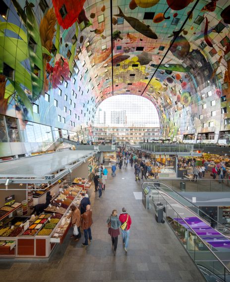 The first indoor market hall of the Netherlands is designed by renowned architecture firm MVRDV. The Markthal is open 7 days per week until 8 p.m. and has 100 fresh produce units, 15 food shops, 8 restaurants and 228 apartments. More than 4.000 colourful tiles cover the inside of the arch and forms the largest artwork in the Netherlands: The Horn of Plenty, designed by Arno Coenen and Iris Roskam.