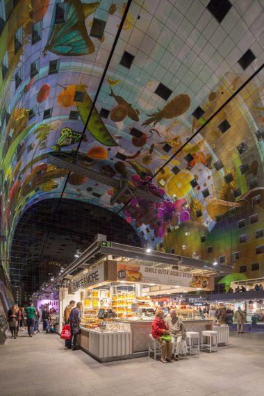 This first covered market hall in the Netherlands contains about 100 fresh food stands, nearly 15 food shops and various restaurants. The roof of the Markthal is shaped by an arch of 228 apartments. The inside of the archway bears the biggest artwork in the Netherlands, The Horn of Plenty by Arno Coenen and Iris Roskam.