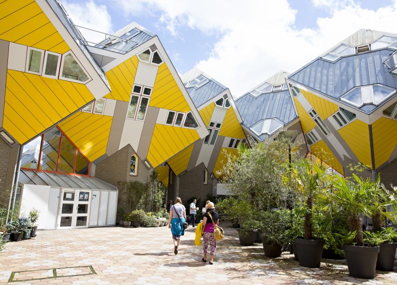 Tourists visiting the Cube Houses, designed by Piet Blom.
