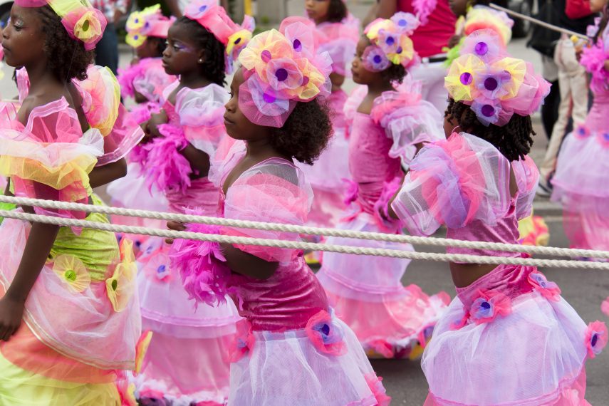 Girls in pink walk along with the parade at the Summer Carnival.