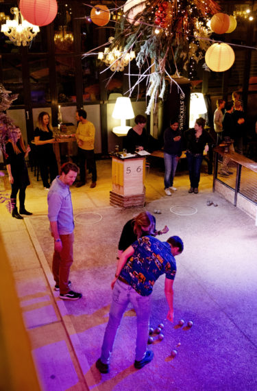 People playing jeu de boules as seen from above.
