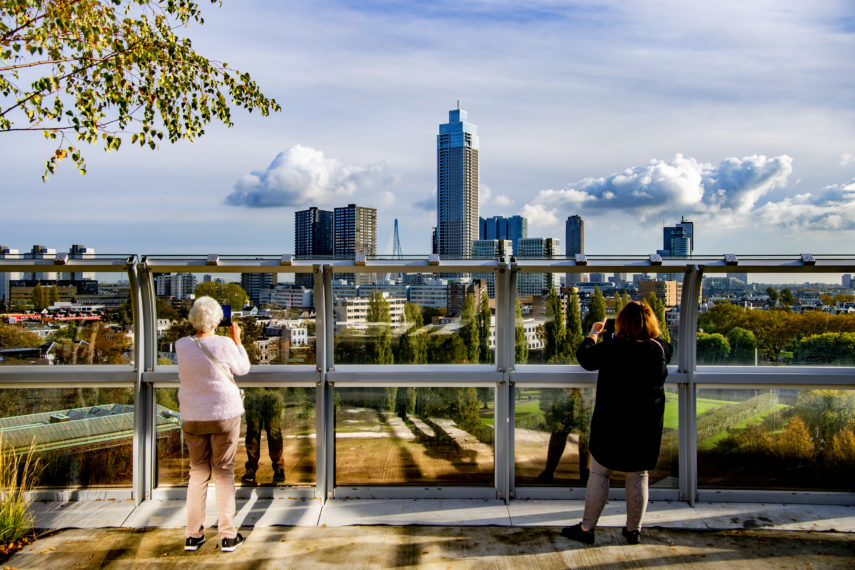 Visitors enjoying the views of Rotterdam from the rooftop garden of Depot Boijmans Van Beuningen.