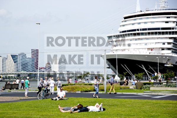 Summertime at quay near Hotel New York, cruise ship Holland America Line and Erasmusbridge in background